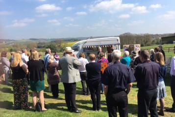 A group of people sitting and chatting at the Rural Kent Coffee Caravan 